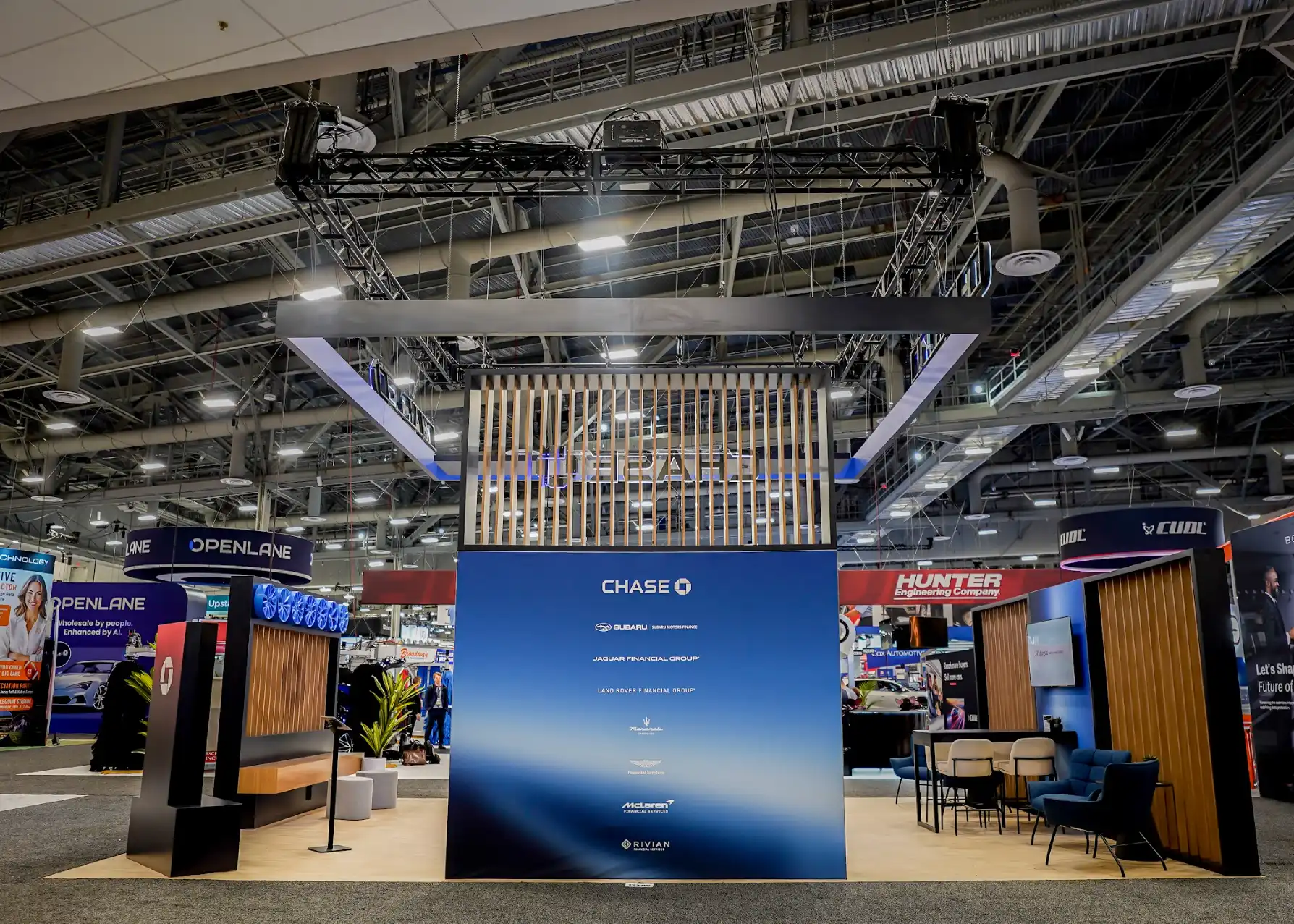 Chase Auto booth partner wall showcasing seven OEM financing partnerships with Chase blue branding and premium graphic displays
