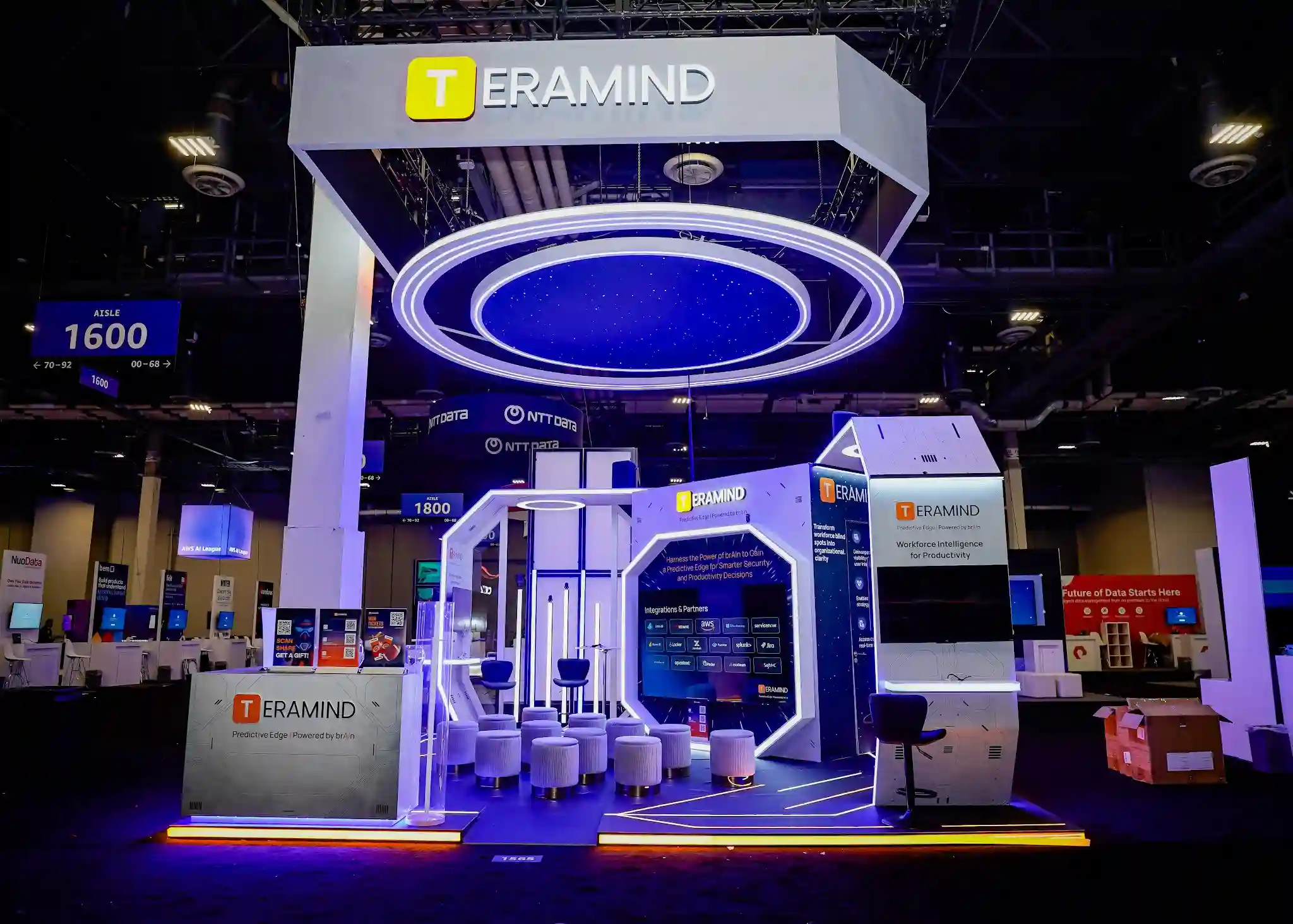 Alternate perspective showing interactive screen, seating area, and neon blue overhead lighting