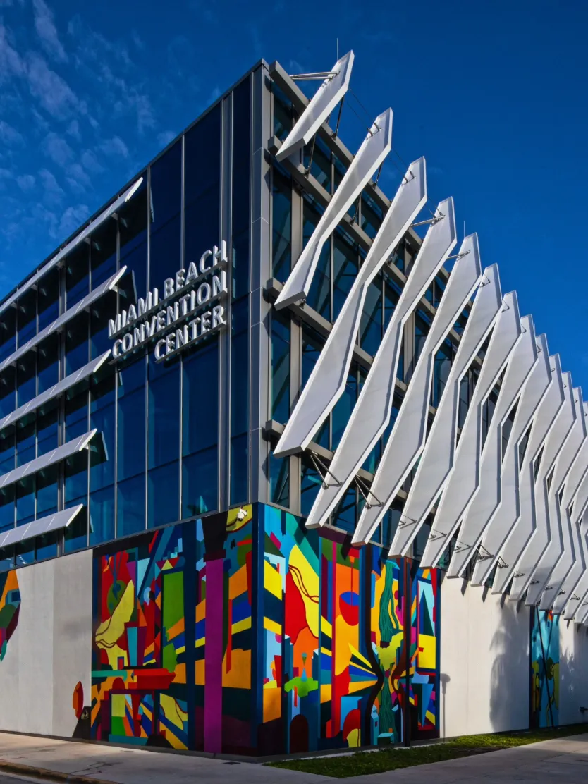 Inside the Miami Beach Convention Center during a major trade show — active show floor with varied booth configurations Inside the Miami Beach Convention Center during a major trade show — active show floor with varied booth configurations