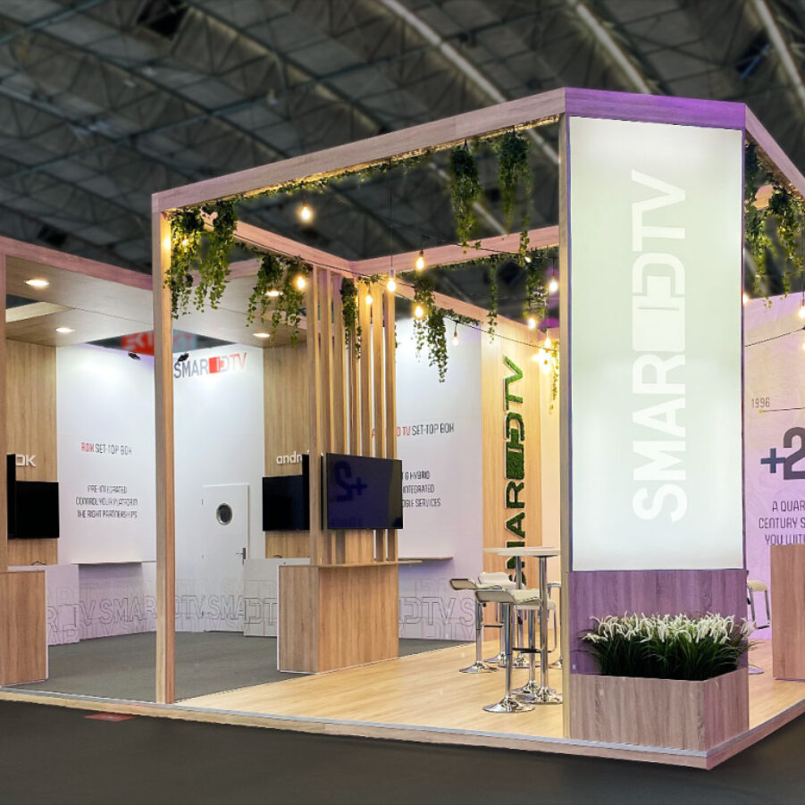 Modular exhibit booth built from reusable aluminum frame components and recyclable fabric graphics, staged in a warehouse for reuse Modular exhibit booth built from reusable aluminum frame components and recyclable fabric graphics, staged in a warehouse for reuse