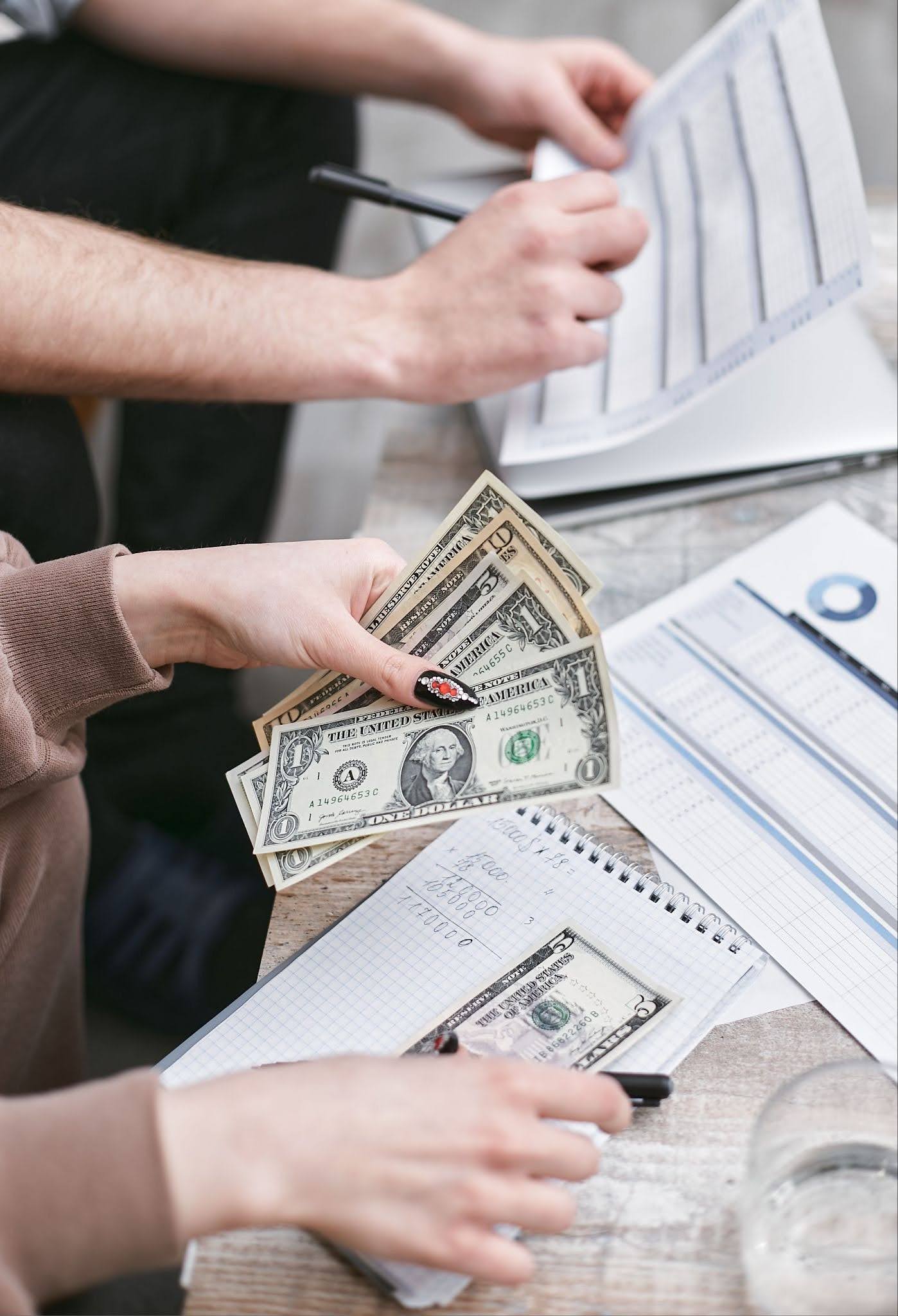 Trade show budget planning with spreadsheets, cash, floor plan, and cost calculations for exhibit expenses, booth rentals, and event budgeting. Trade show budget planning with spreadsheets, cash, floor plan, and cost calculations for exhibit expenses, booth rentals, and event budgeting.