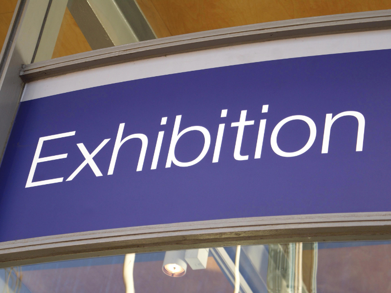 Exhibition.png a board with word 'Exhibition" conveying trade exhibition meaning and types