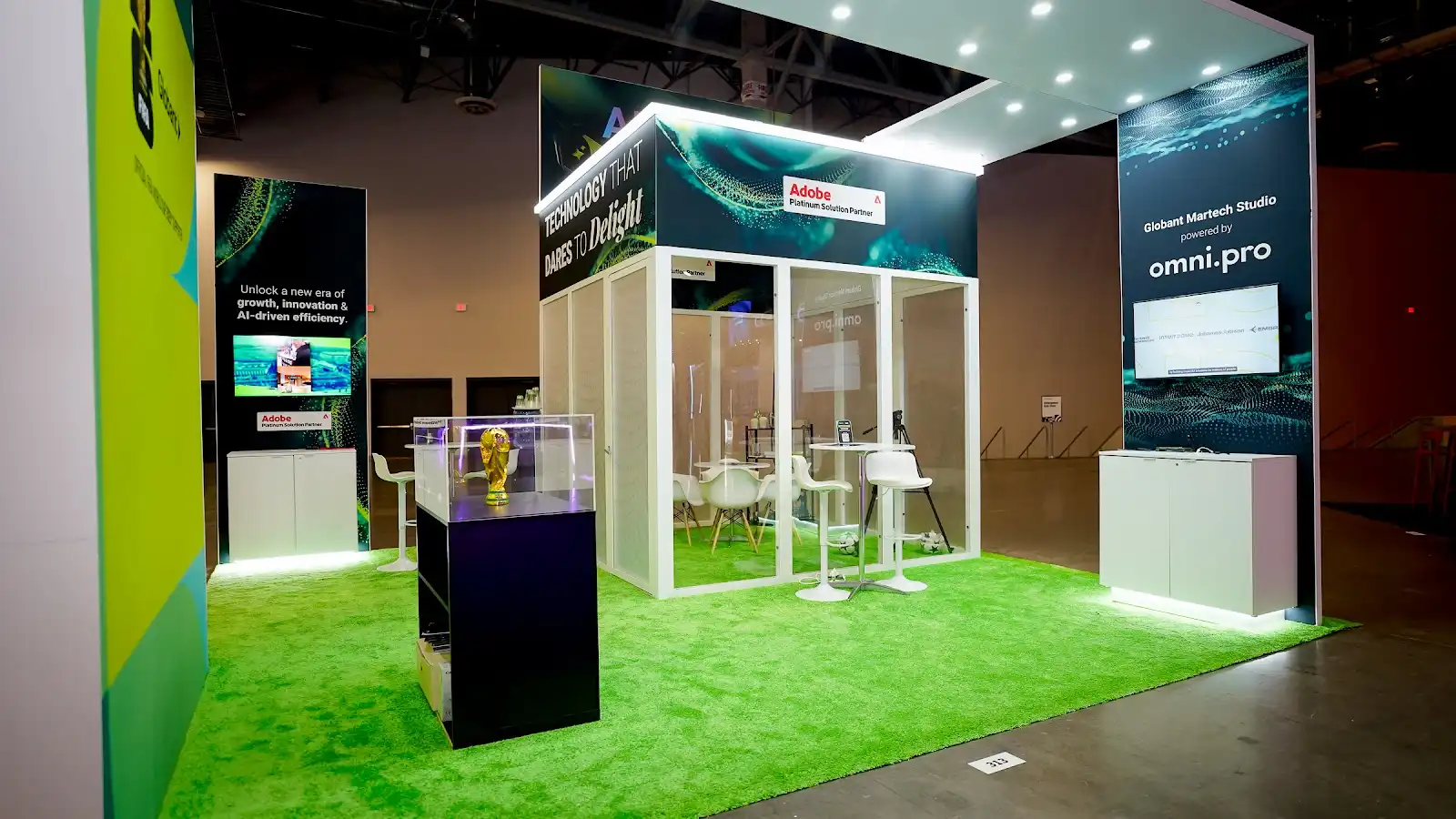Globant martech studio exhibit at Adobe Summit 2026, showing the working studio layout built for Adobe Experience Cloud demonstrations rather than a hospitality lounge