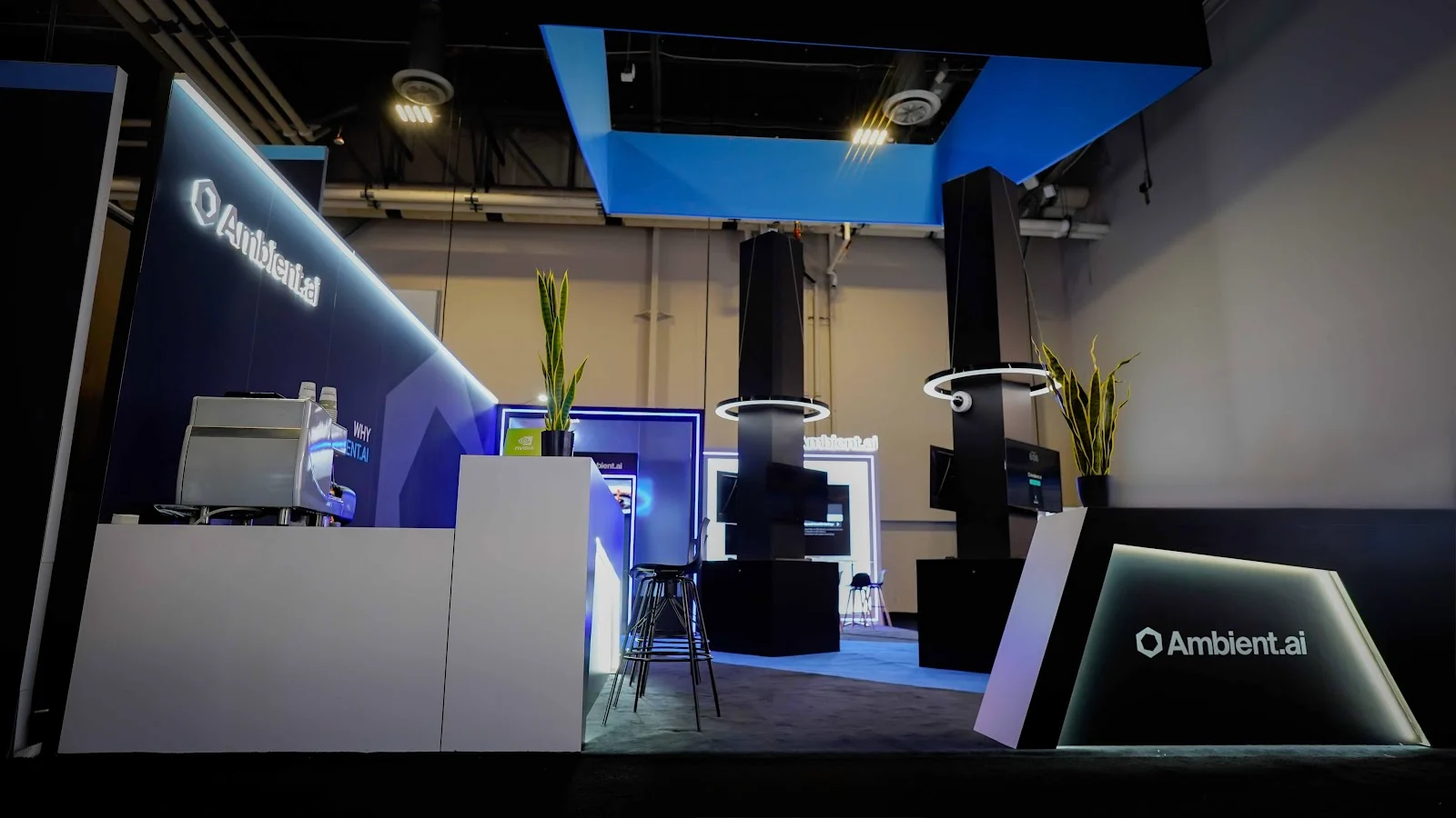 Modern technology exhibit for Ambient.ai at ISC West 2026, with screens arranged to resemble a working security operations centre