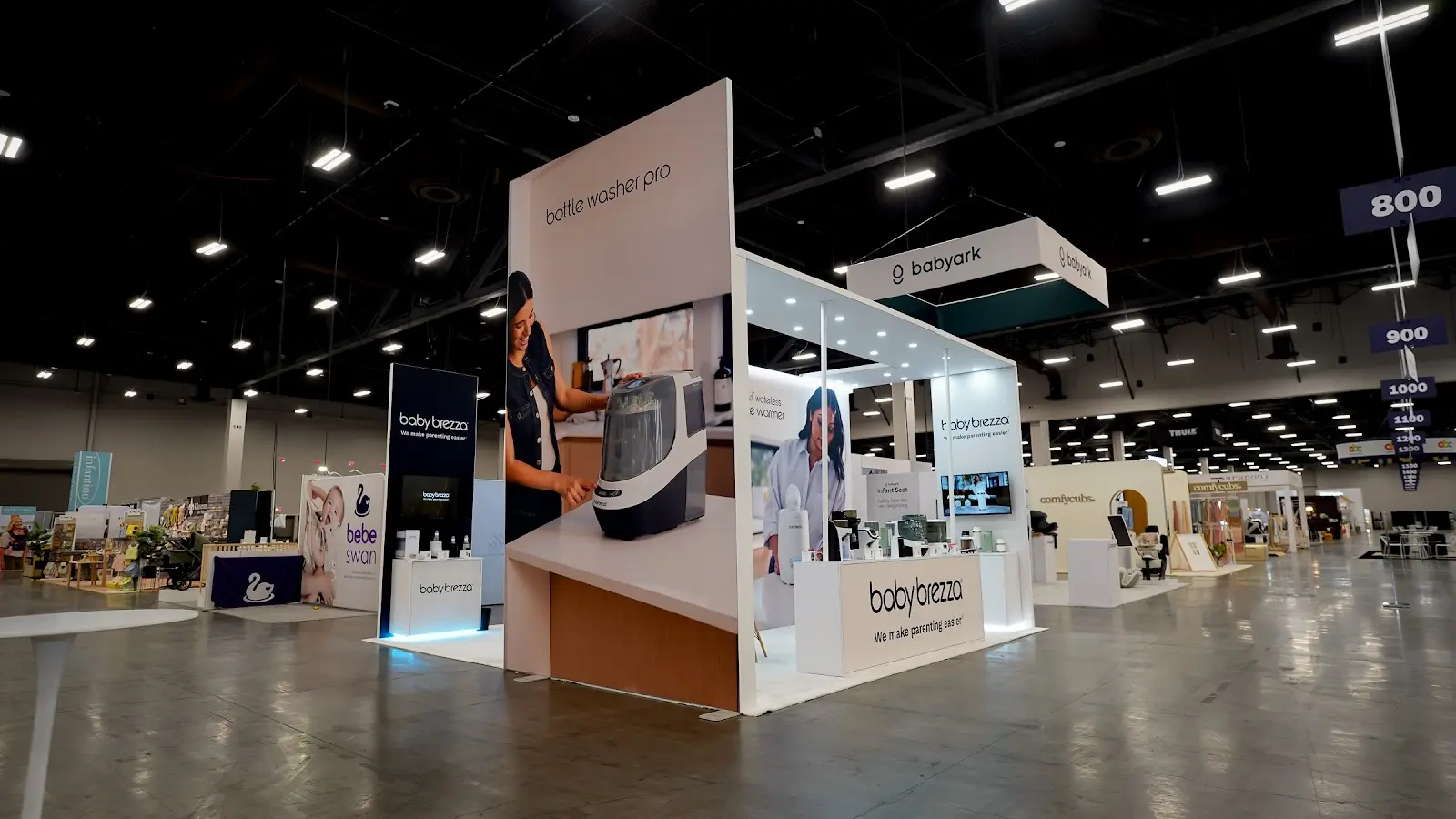 Interior view of the Baby Brezza booth at ABC Kids Expo 2026 with space for buyer conversations alongside the product displays