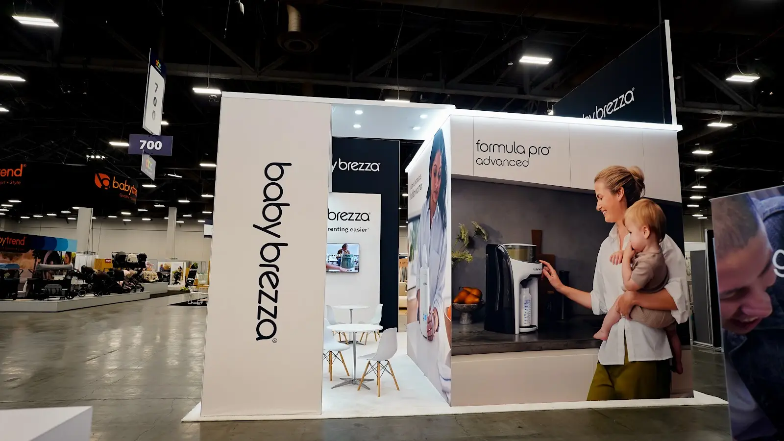 Formula Pro product display inside the Baby Brezza island booth at ABC Kids Expo 2026, presented on clean white surfaces for retail buyers