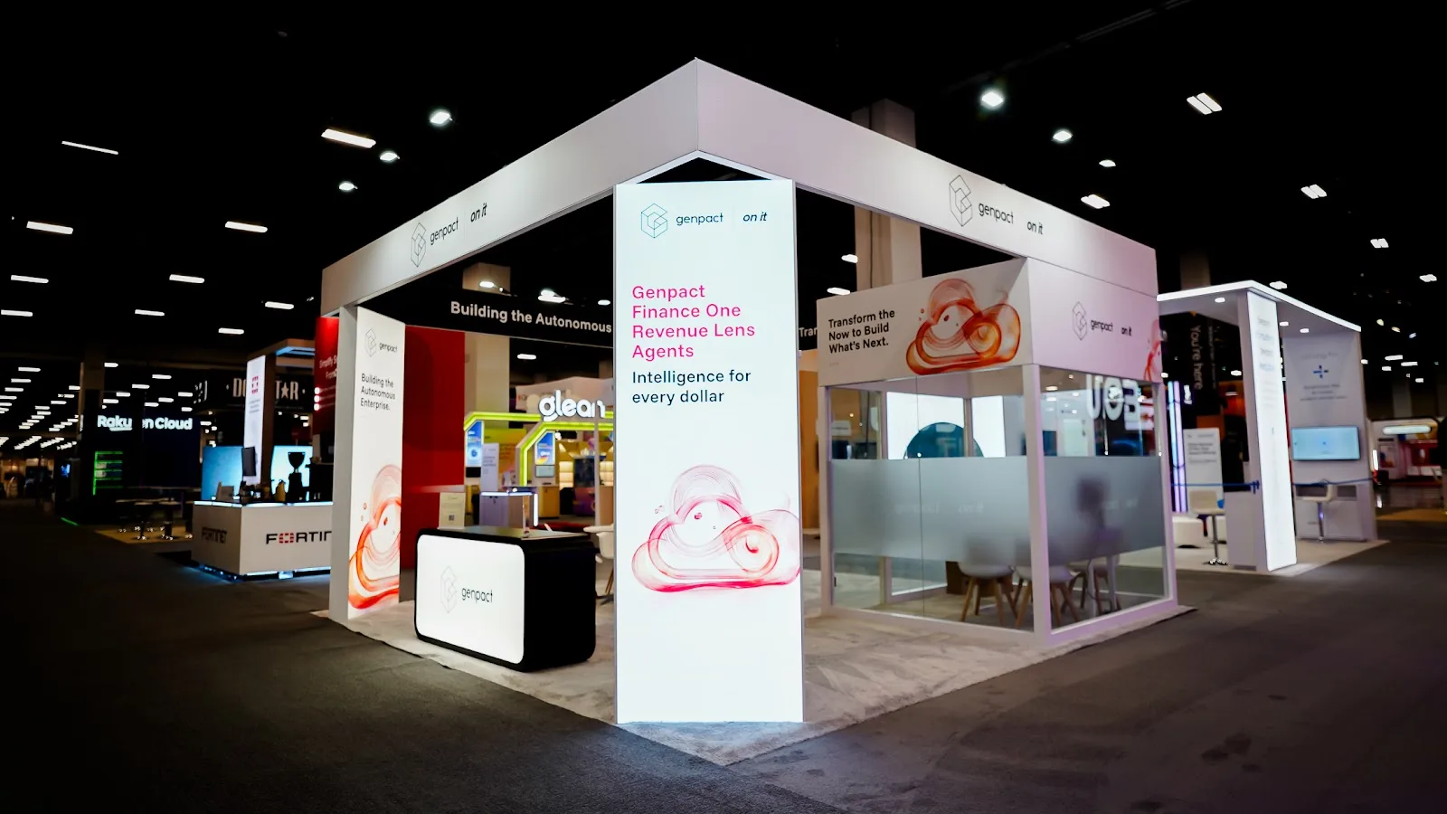 Full view of the Genpact custom island trade show booth at Google Cloud Next 2026 under show conditions at Mandalay Bay in Las Vegas