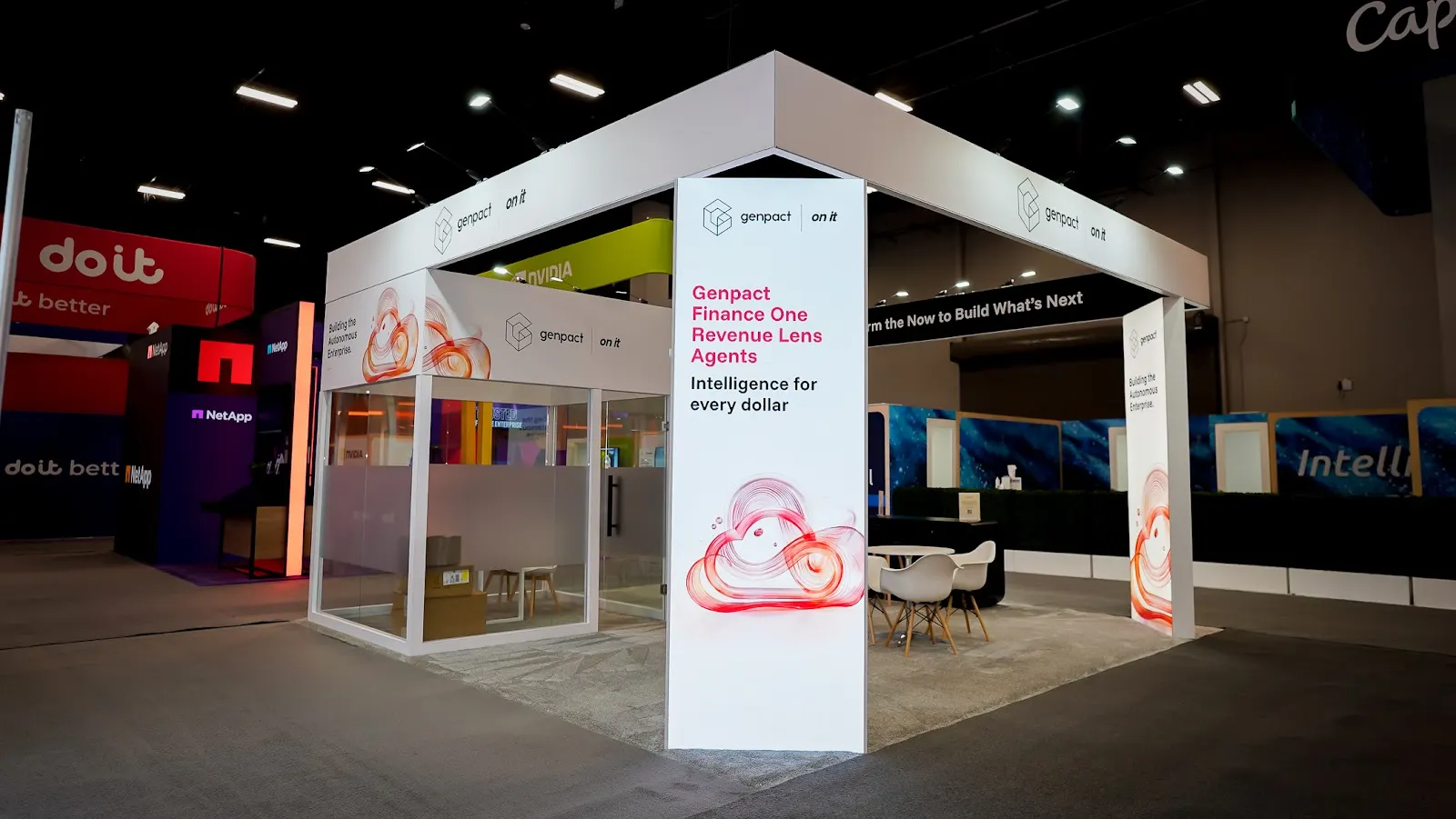 Enclosed private meeting space inside the Genpact exhibit at Google Cloud Next 2026, seating executives away from show floor traffic