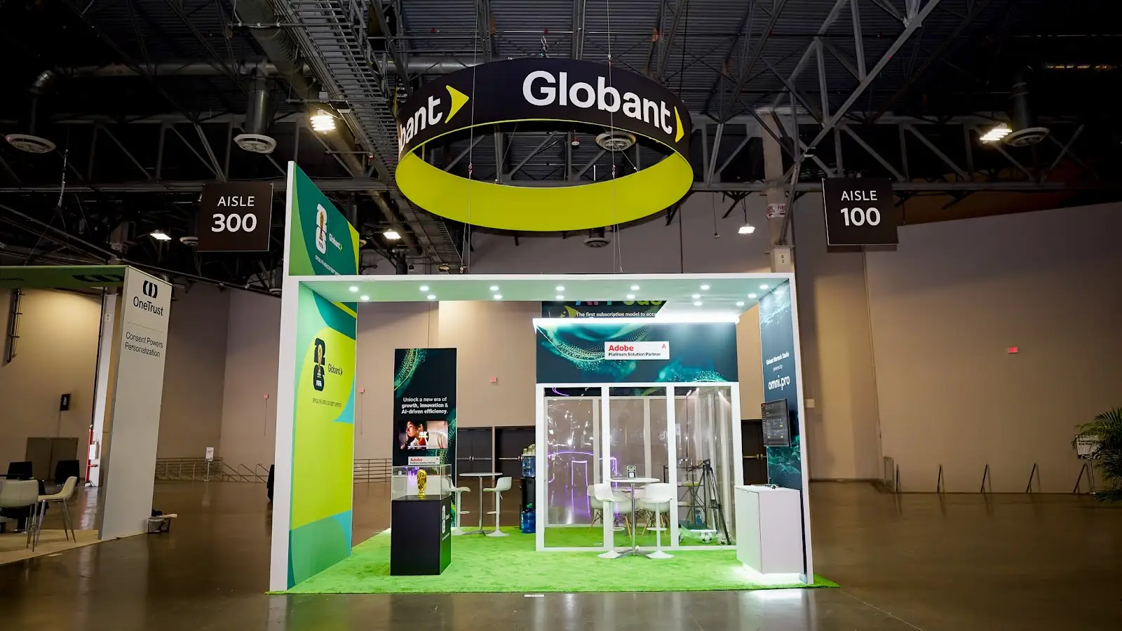 Globant 20x30 green custom island booth at Adobe Summit 2026, seen from the aisle at the Venetian Convention and Expo Center in Las Vegas