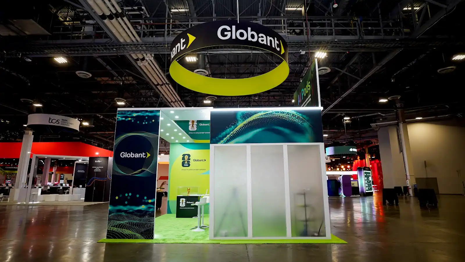 Detail view of the Globant island exhibit at Adobe Summit 2026 showing structural framing and branded surfaces on the Venetian Expo floor