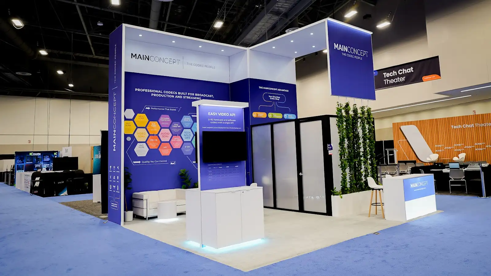 MainConcept tech chat theater configuration at NAB Show 2026 showing a dedicated seating and demonstration area designed for in-depth SDK conversations and codec technology discussions with visiting engineers