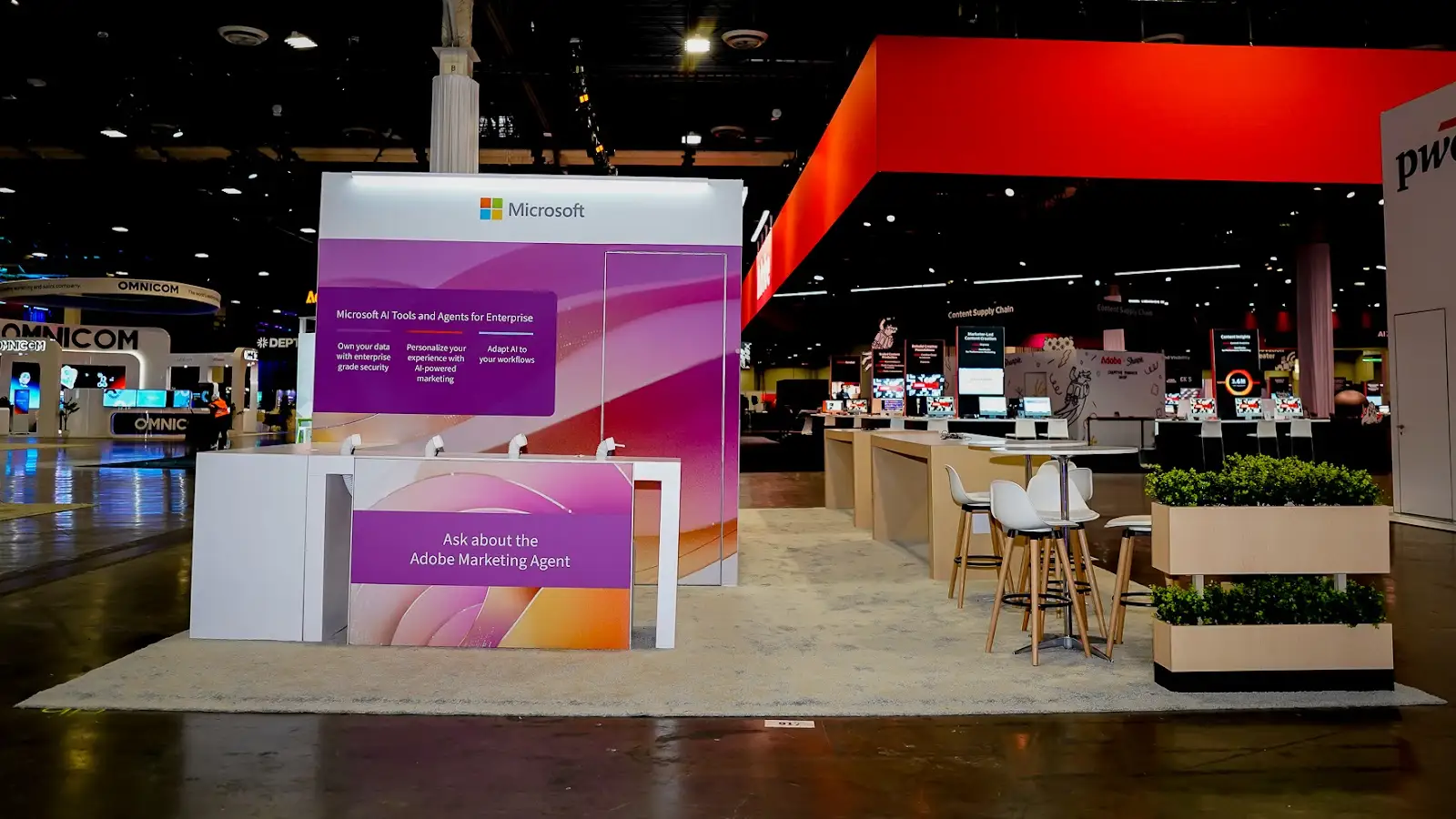 Microsoft exhibit at Adobe Summit 2026 showing Adobe Marketing Agent messaging integrated into the booth graphics alongside Microsoft branding