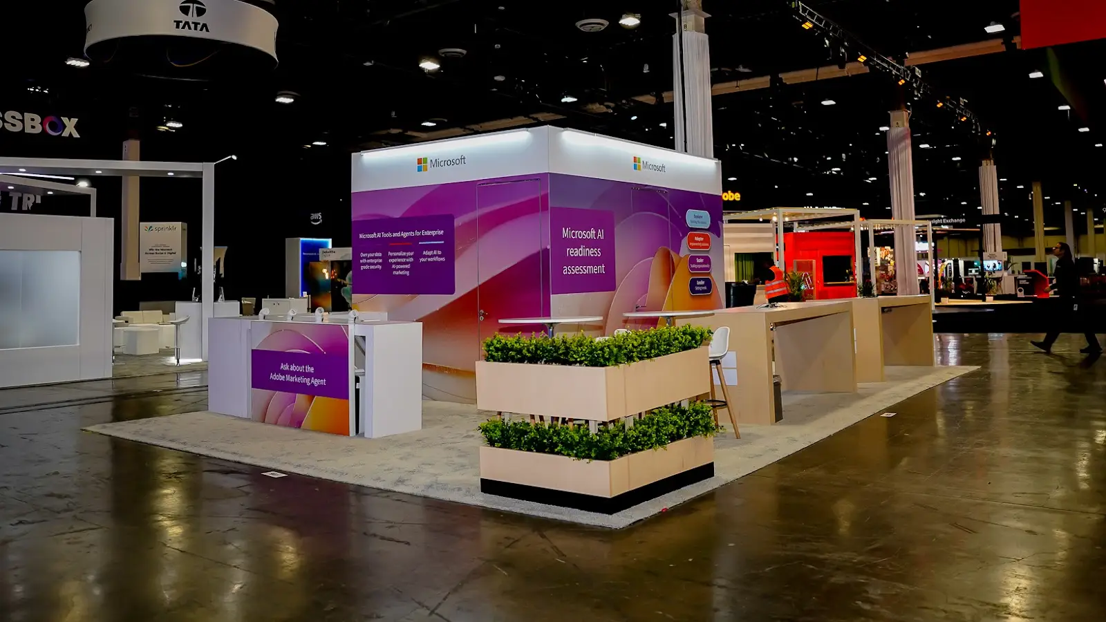 Detail of the AI readiness assessment area in the Microsoft exhibit at Adobe Summit 2026, showing the station layout and surrounding standing room