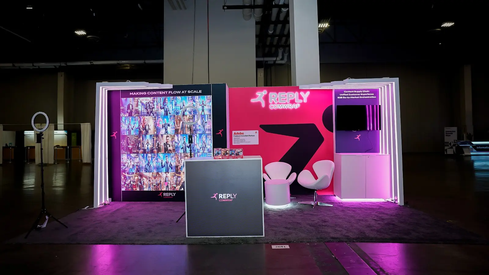 Comwrap Reply trade show booth at Adobe Summit 2026 built by Pure Exhibits