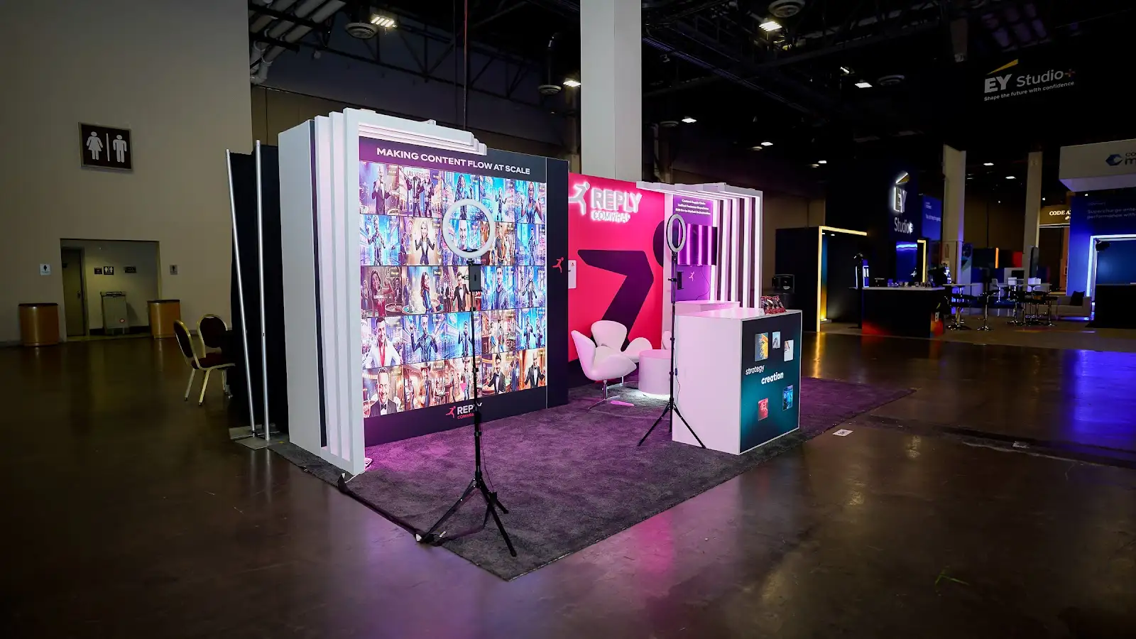 Social media interactive display in the Comwrap Reply booth at Adobe Summit 2026, giving attendees a shareable moment inside the illuminated exhibit