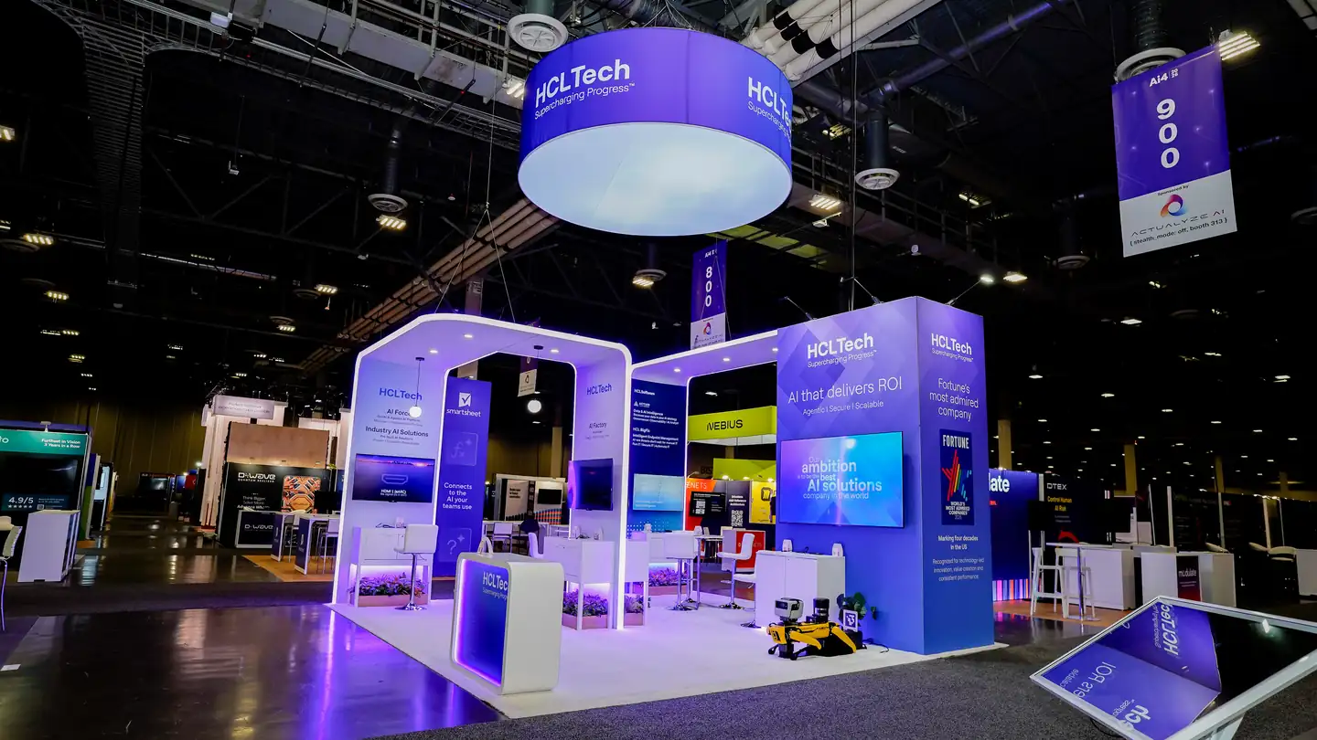 Three-quarter view of the completed HCLTech custom island booth at Ai4 2026 in The Venetian