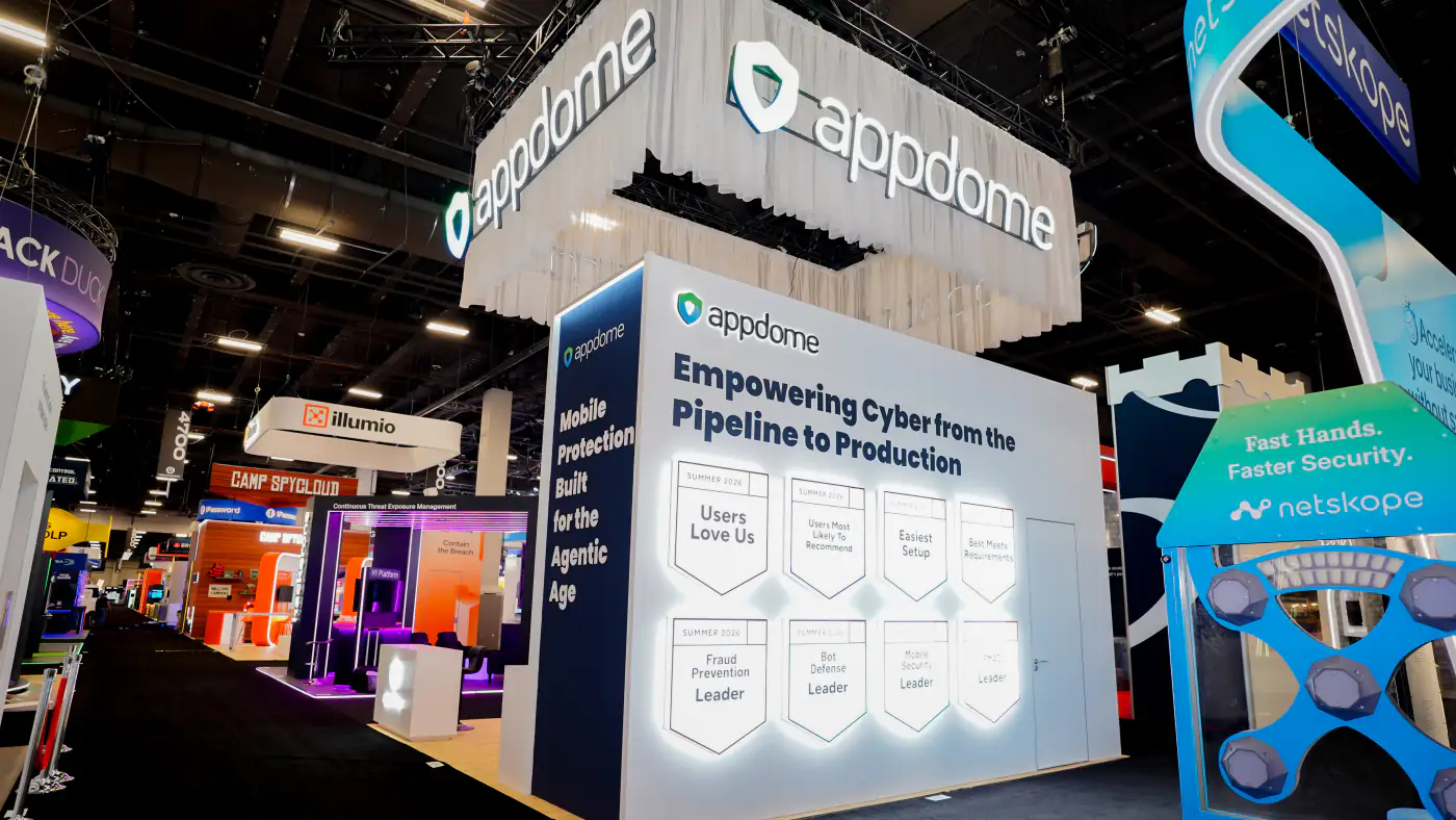 Appdome booth at Black Hat USA 2026 showing the sheer-draped hanging sign above the backlit G2 badge wall and the Mobile Protection Built for the Agentic Age pillar