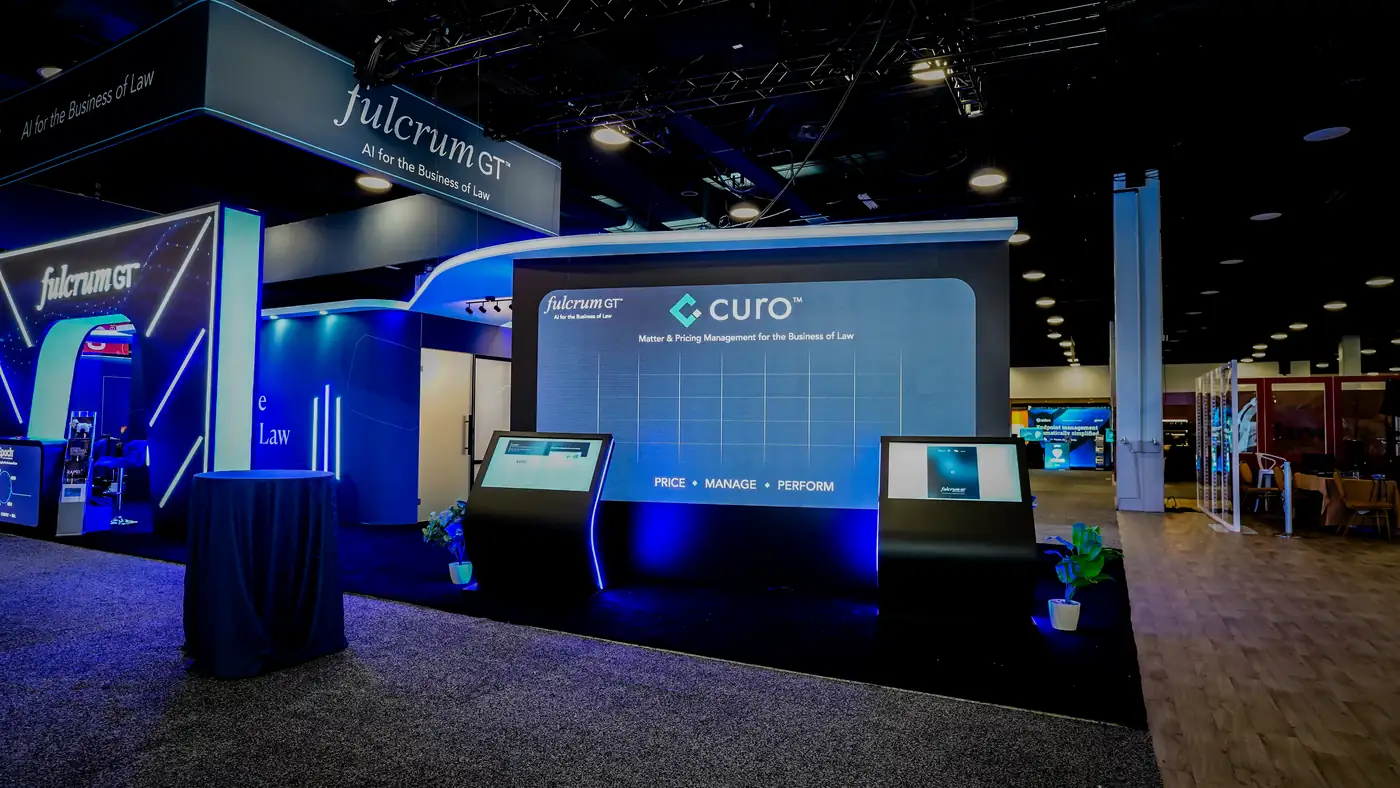 Curo pricing LED wall inside the Fulcrum GT booth at ILTACON 2026