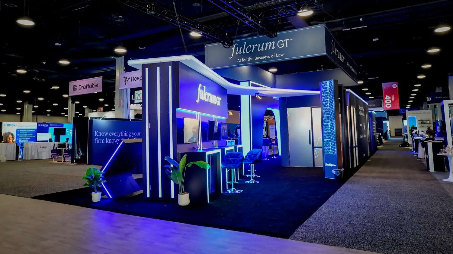 Demo stations with touch-screen kiosks and screens at the Fulcrum GT booth, ILTACON 2026