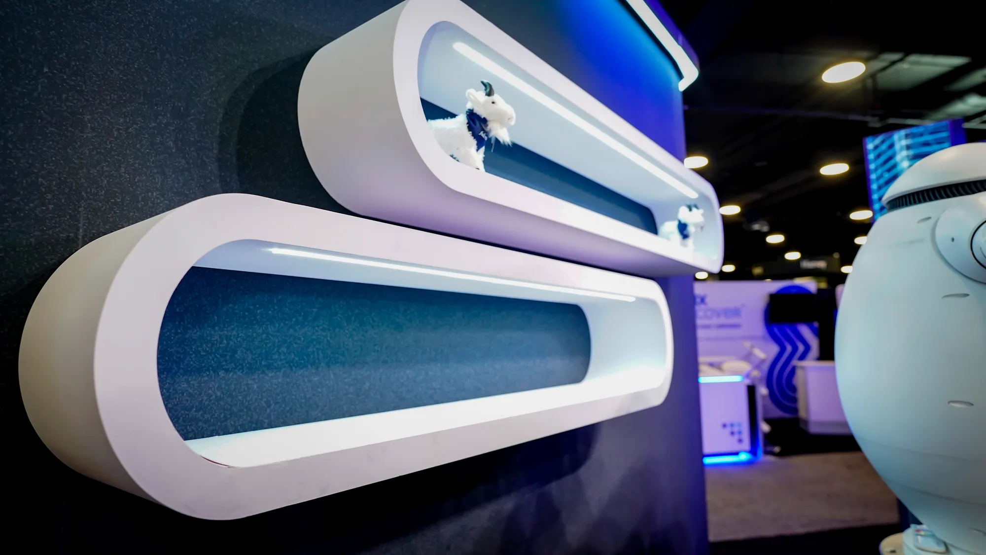 Chrome capsule display shelves with greenery inside the Fulcrum GT booth at ILTACON 2026